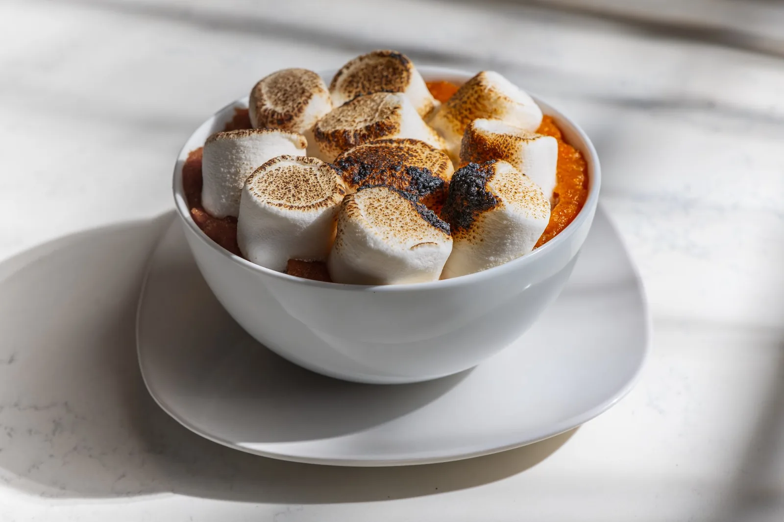 Candied yams under toasted marshmallows
