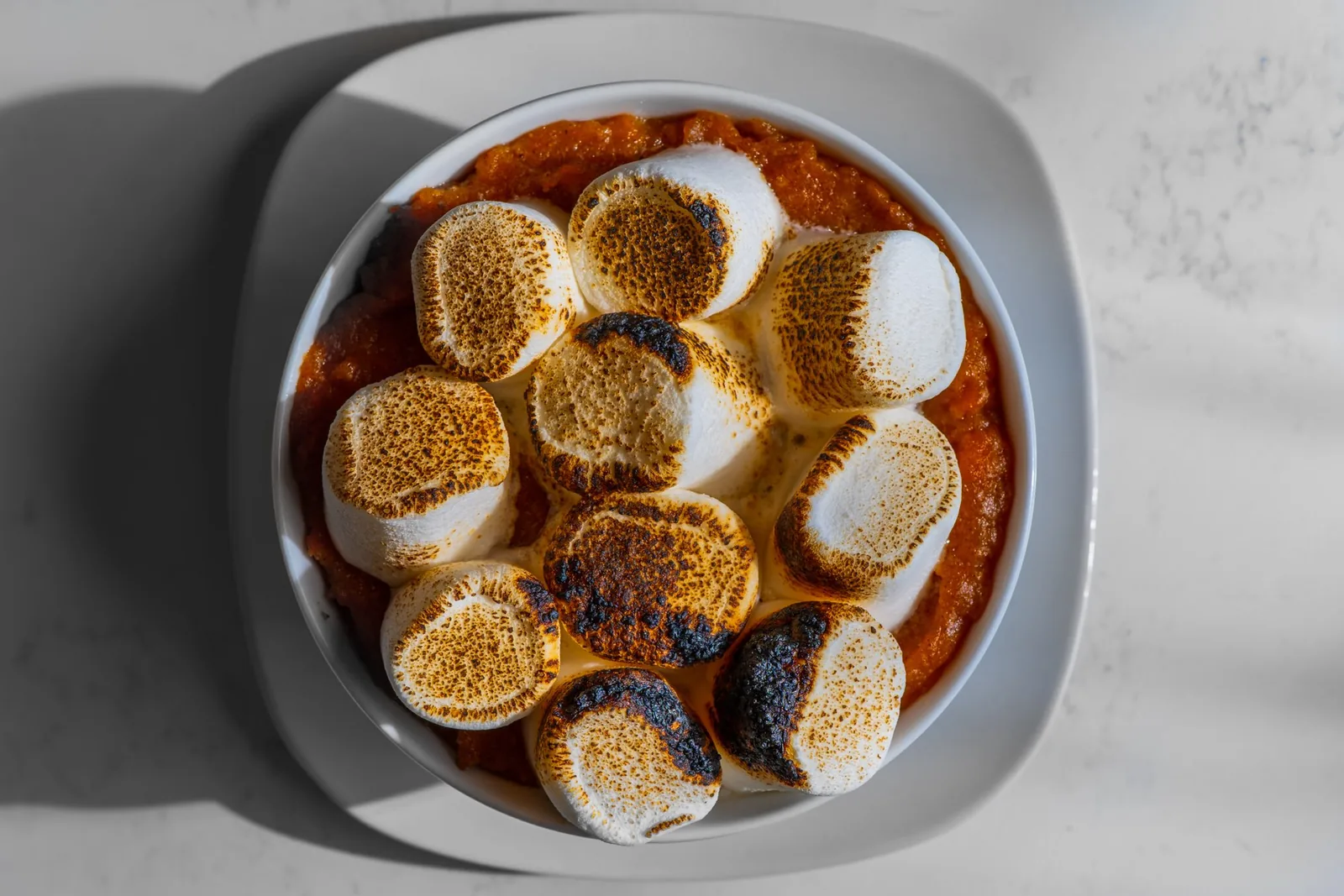 Sweet potatoes topped with toasted marshmallows